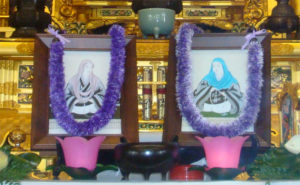 framed images of Kakushinni, left, and Eshinni, right, before the altar at Hawaii Betsuin