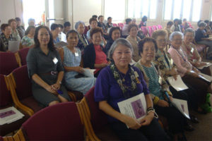 women holding programs seated in Hawaii Betsuin's Annex Temple